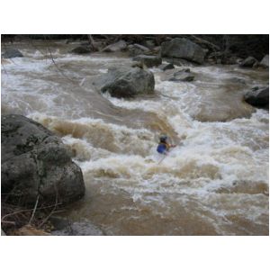 Jim Pruitt burying canoe in main hole of the big South Fork rapid (Photo by Lou Campagna - 4/26/04)