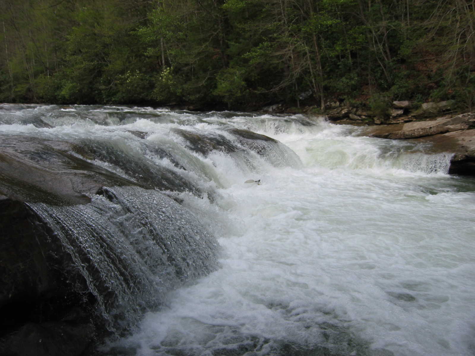 Keith Merkel submerged at bottom of Lunch Ledge.  Where was that boof? (Photo by Scott Gravatt - 4/27/04)