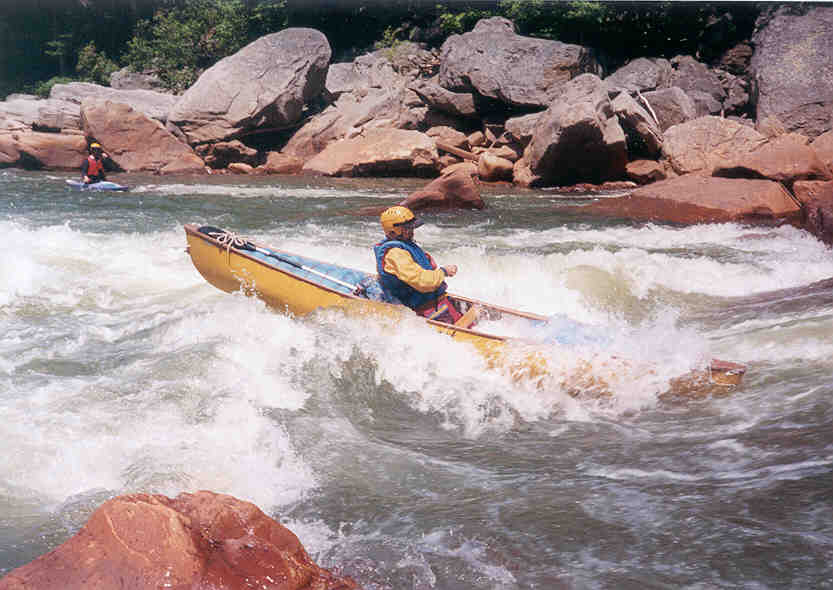 Bruce Labaw, a kayaker, makes surfing Big Nasty in an open canoe look easy (Photo by Scott Gravatt) 