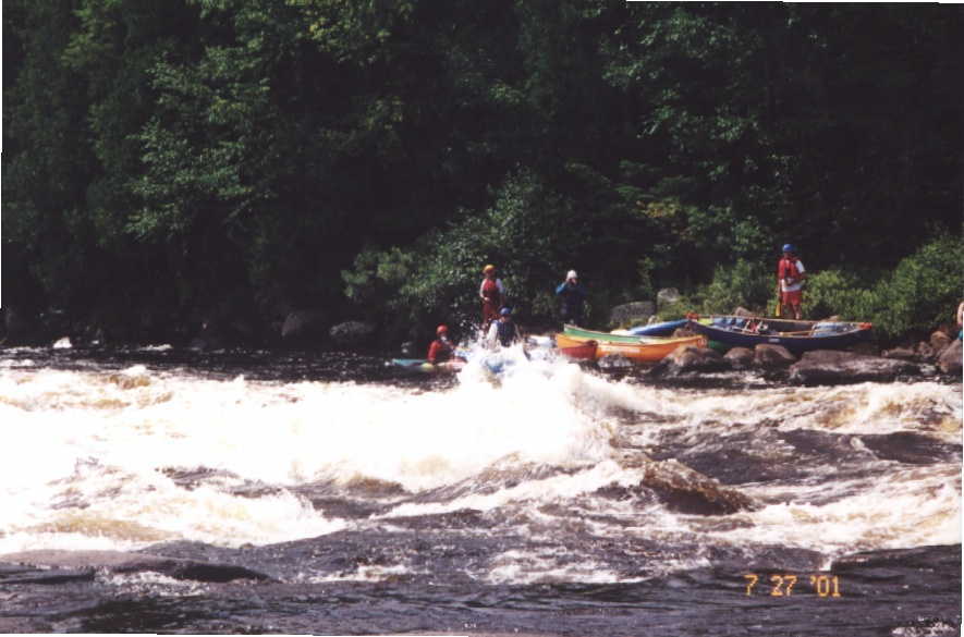 Denise Gravatt cresting big wave in long Class 3-4 rapid (Photo by Keith Merkel - 7/27/01)