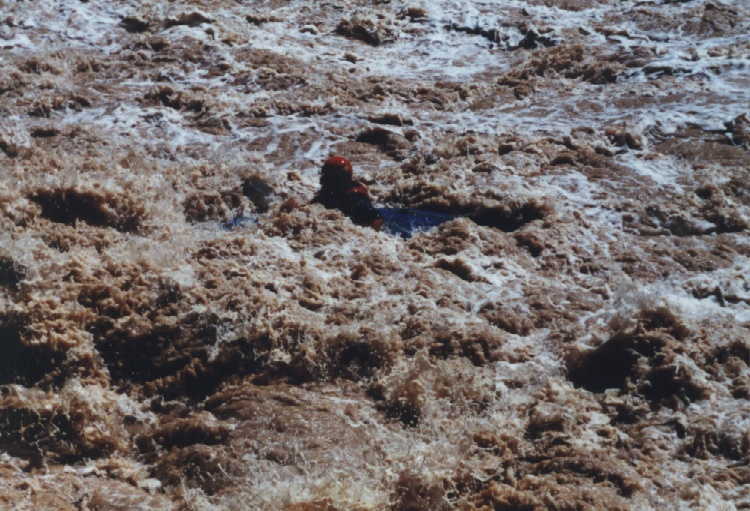 Dave Garrity approaching big wave/hole in Lava Falls, backwards