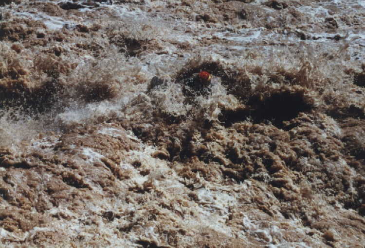 Dave Garrity hitting big wave/hole in Lava Falls, backwards