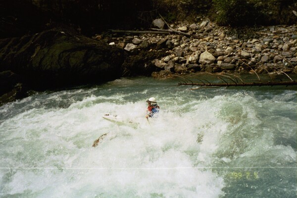 Cahil Converse in rapid entering mini-canyon (where's the Class IV rapid?) (Photo by Keith Merkel - 7/5/99)