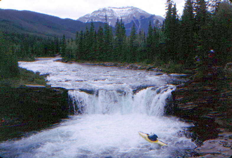 Keith Merkel looking up at Sheep Falls with beatiful Canadian Rockies scenery (Photo by Bob Maxey - 6/28/99)