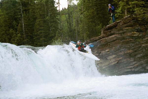 Hans Haucke taking flight at Sheep Falls (Photo by Keith Merkel - 6/28/99)