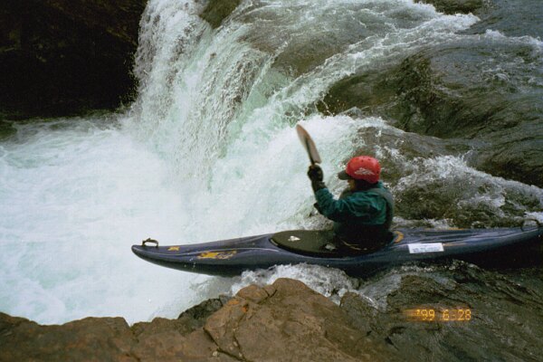 Lee Belknap poised for launch at Sheep Falls (Photo by Keith Merkel - 6/28/99)